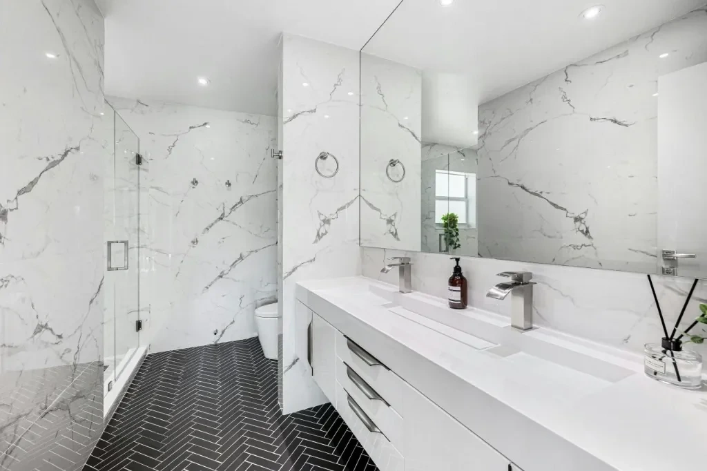 Luxury modern white marble bathroom cleaned to perfection by Splash Maids